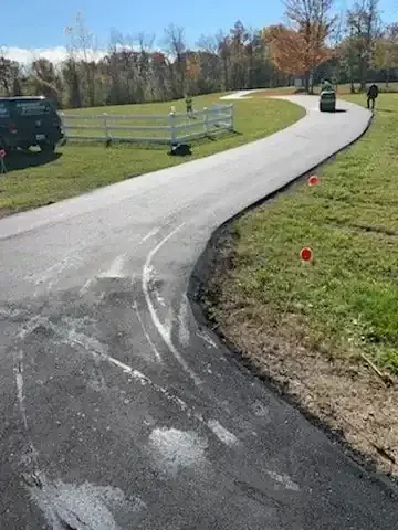 Long private drive through open land